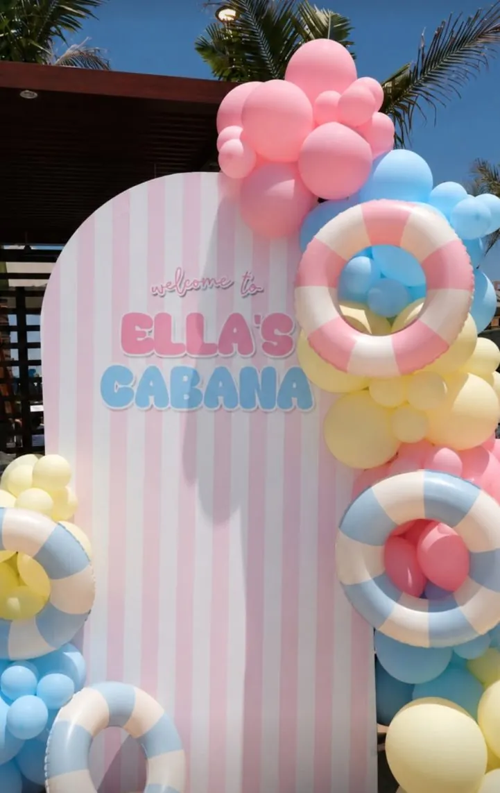 Pastel balloon backdrop with pool floats for Ella's Cabana