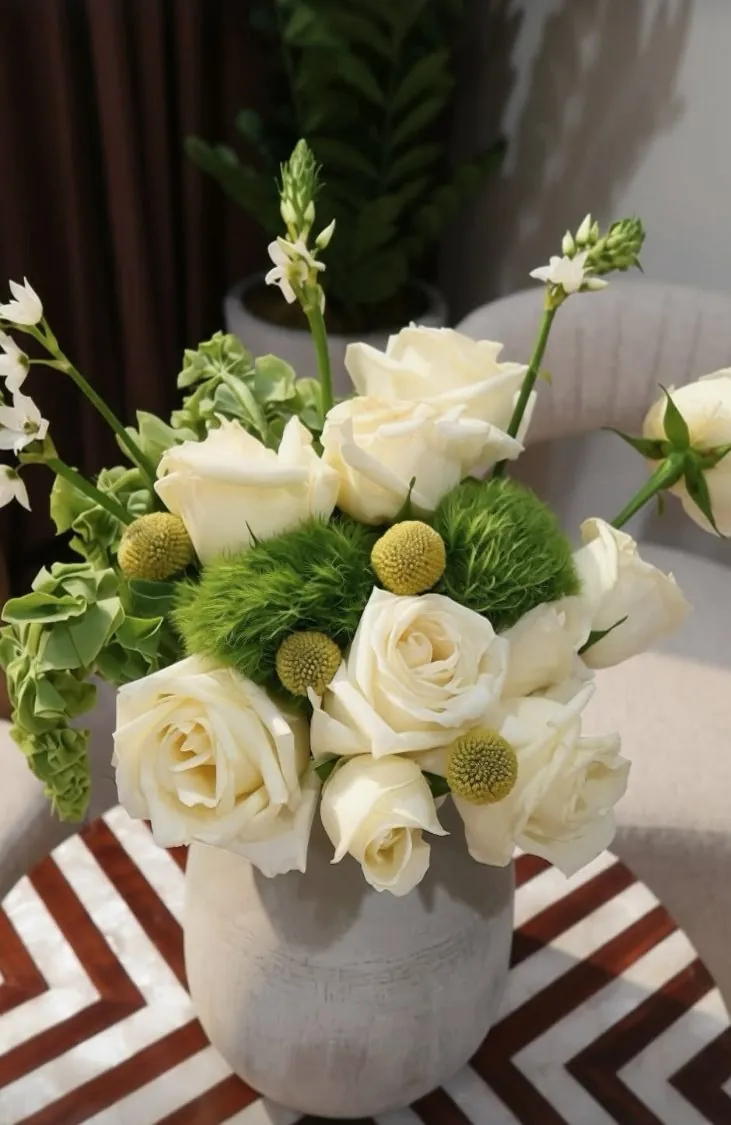 White roses and greenery arrangement
